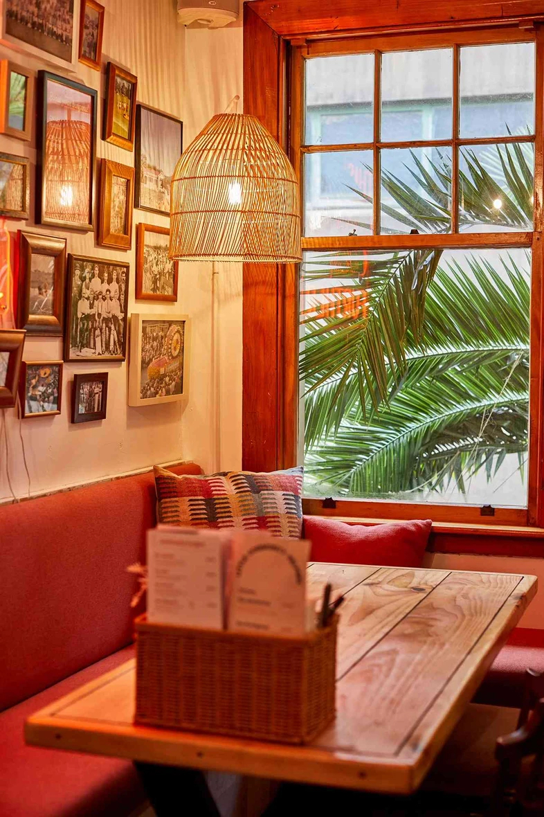 Warm interior seating inside Community Burgers restaurant in Napier