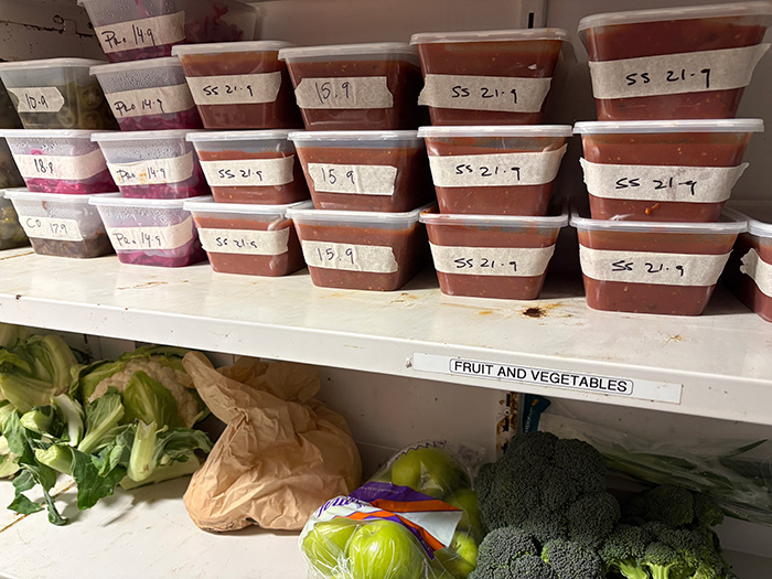 Batches of Community Burgers tomato jam chilling before service